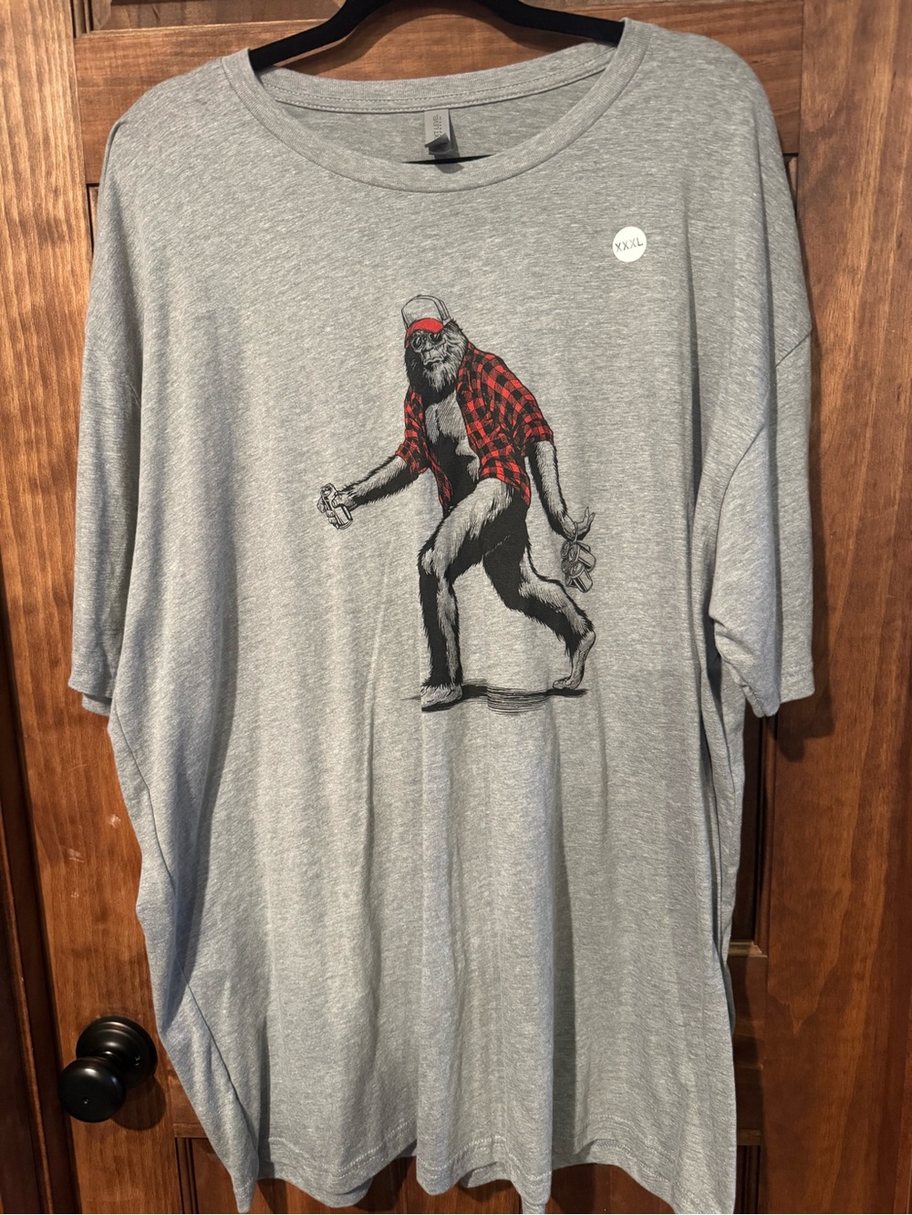 Next Level Apparel Gray T-Shirt with Red Plaid Sasquatch Graphic
